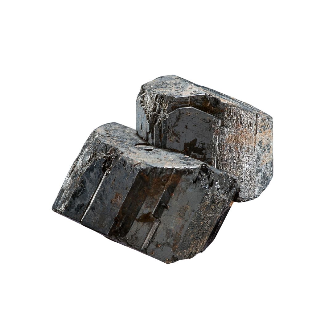 Horneblende. A black shiny mineral on a white background