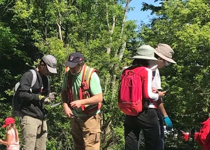 Image of people dressed for the outdoors rockhounding
