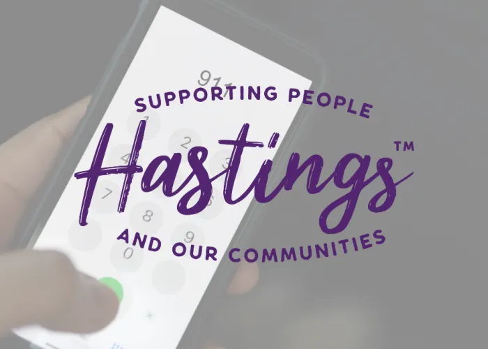 Hastings county logo over photo of phone diling 911