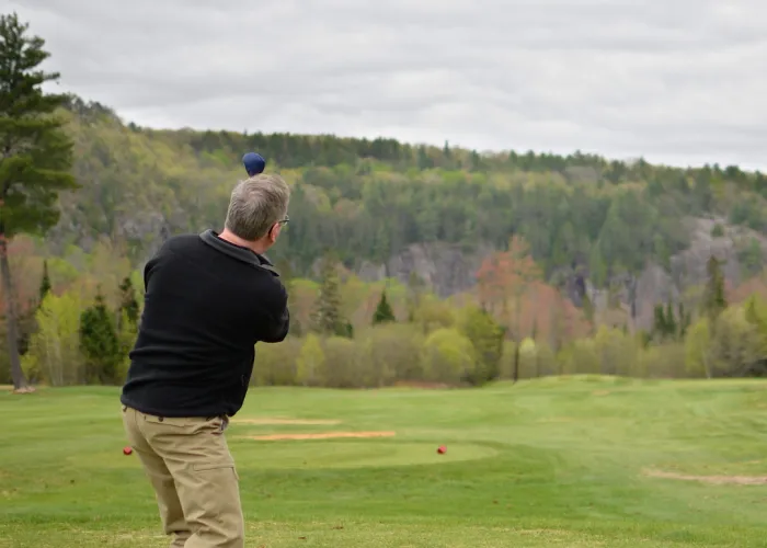 a person golfing