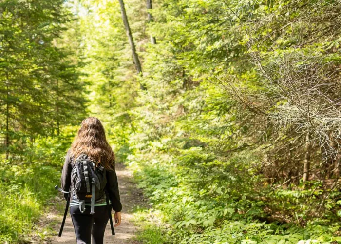 girl walking on a trail