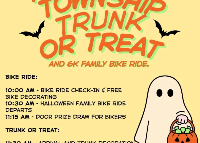 Yellow background, orange and green text stating name of event, silhouettes of bats on either side, black text with event schedule, cartoon of person in ghost costume holding jack o lantern treat basket