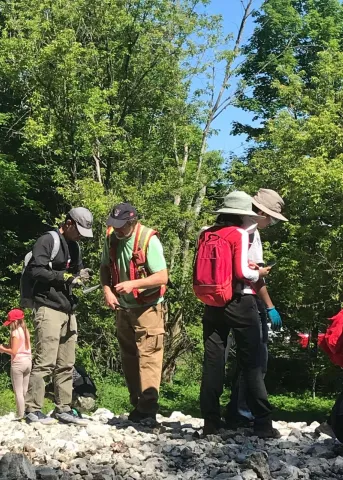Image of people dressed for the outdoors rockhounding